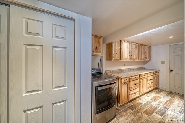 6375 Terrace Ln, Salida, CO 81201 - kitchen with washer / clothes dryer, light brown cabinetry, light countertops, light wood-style flooring, and recessed lighting