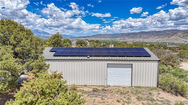 6375 Terrace Ln, Salida, CO 81201 - view of outbuilding with a mountain view and solar panels