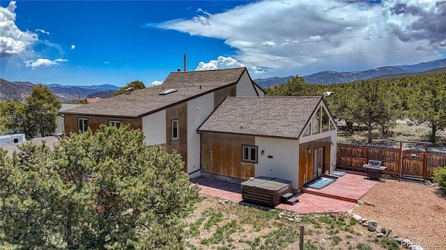 6375 Terrace Ln, Salida, CO 81201 - back of house with a mountain view, a patio, and roof with shingles