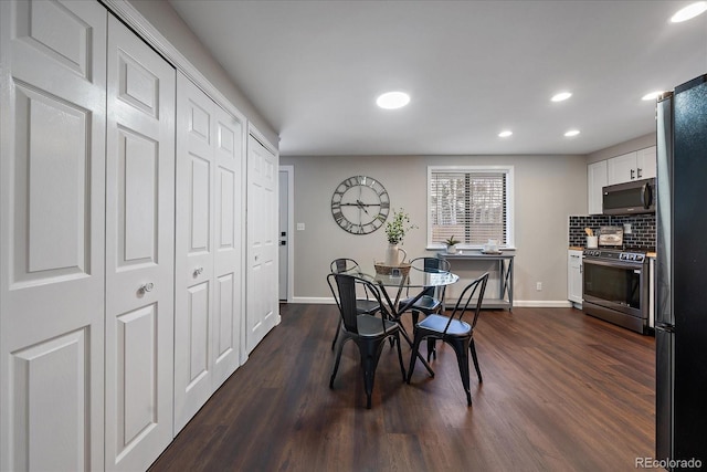 dining area with dark wood-type flooring