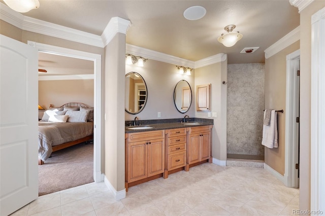 bathroom featuring vanity, tile patterned floors, and crown molding