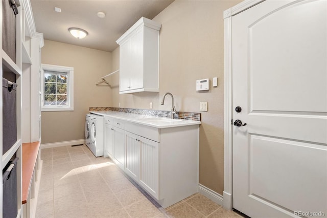 laundry area featuring washer / clothes dryer and sink