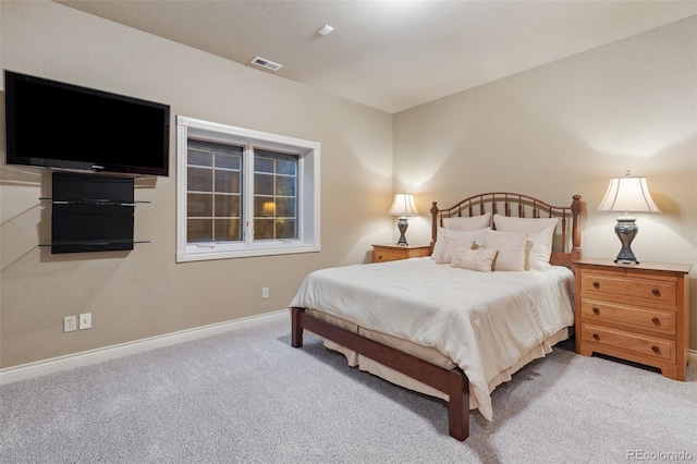 bedroom with light carpet