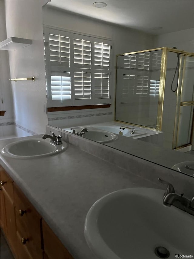 bathroom featuring vanity and a shower with shower door