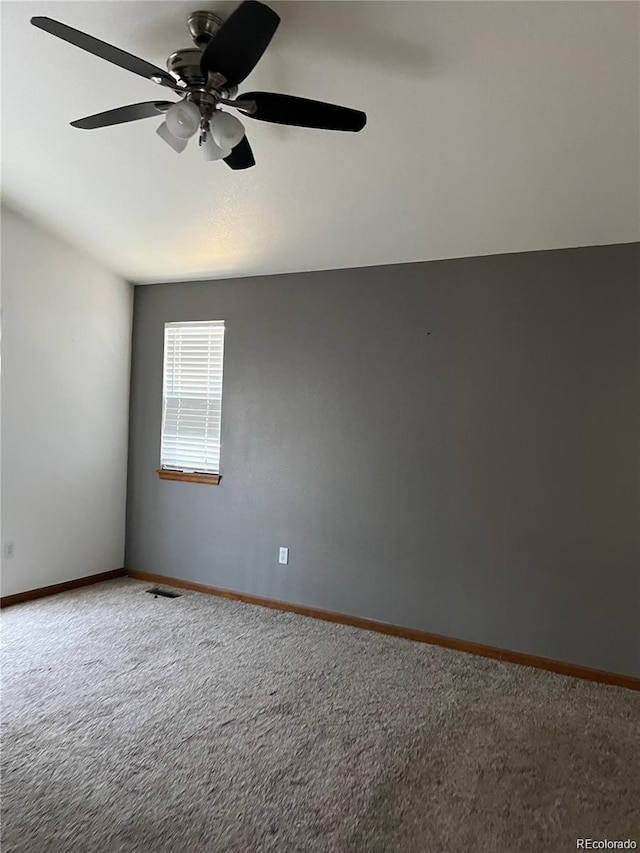 unfurnished room featuring carpet and ceiling fan