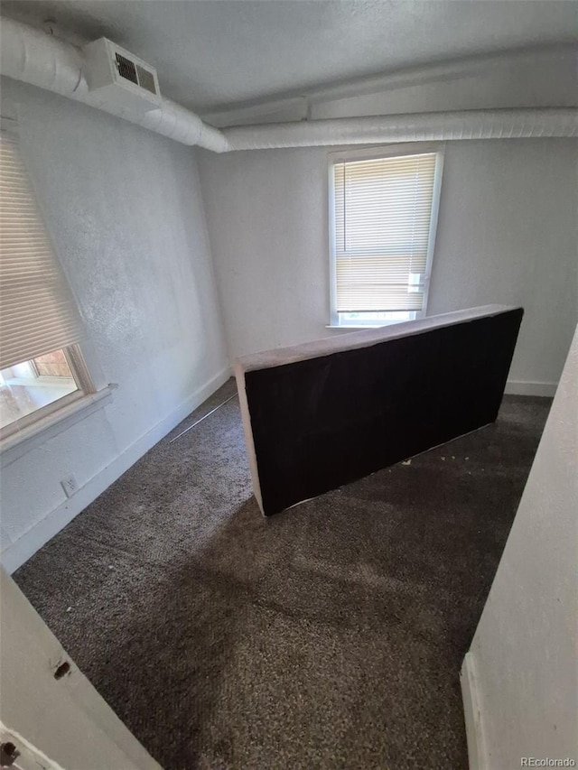 1272 N Ulster St, Denver, CO 80220 - spare room featuring carpet