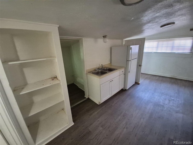 1272 N Ulster St, Denver, CO 80220 - kitchen with a sink, freestanding refrigerator, dark wood-type flooring, a textured ceiling, and light countertops