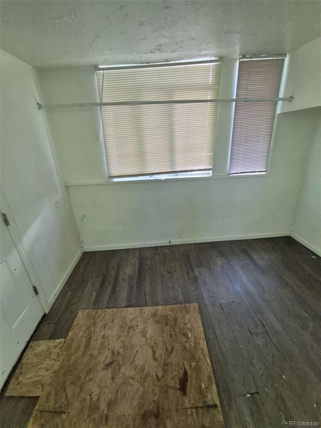 1272 N Ulster St, Denver, CO 80220 - unfurnished room featuring wood finished floors and baseboards