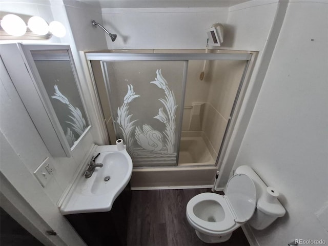 1272 N Ulster St, Denver, CO 80220 - full bathroom featuring a shower with shower door, toilet, wood finished floors, and vanity