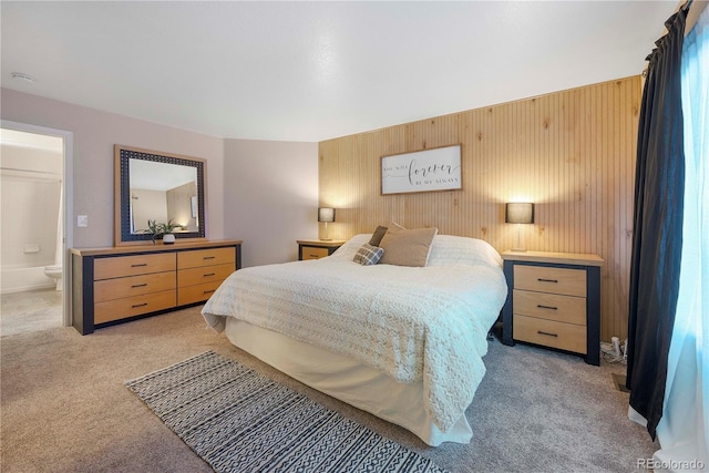 carpeted bedroom with ensuite bathroom