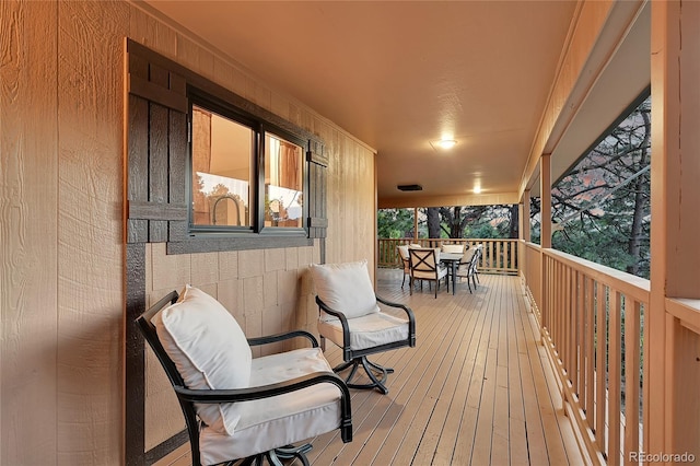 wooden deck with outdoor dining space