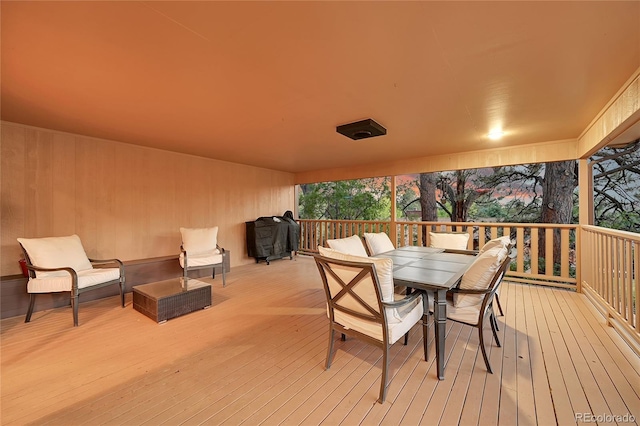wooden terrace featuring outdoor dining space and an outdoor hangout area