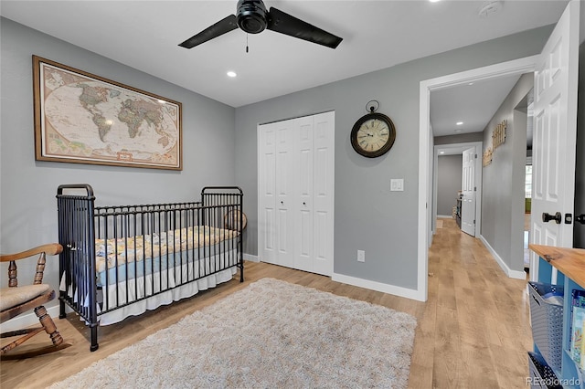 bedroom featuring light wood-style flooring, a closet, baseboards, recessed lighting, and a ceiling fan