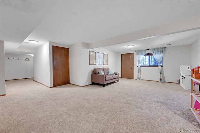 living room featuring light colored carpet and baseboards