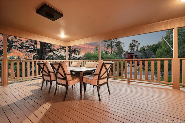 wooden terrace featuring outdoor dining area