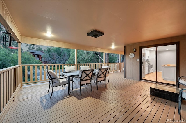 deck featuring outdoor dining area