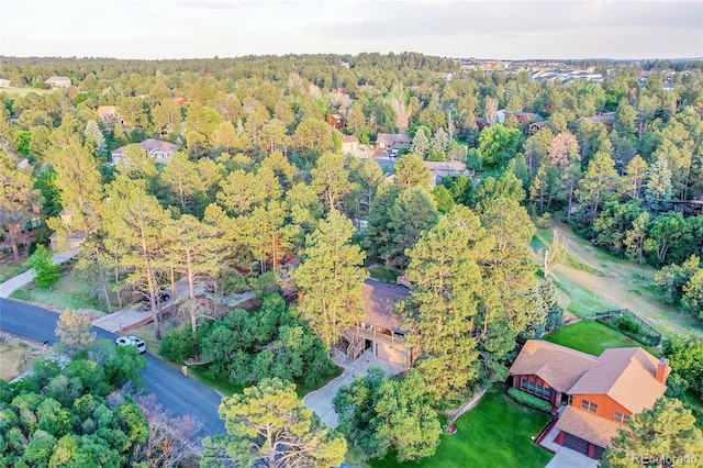 aerial overview of property's location with a forest