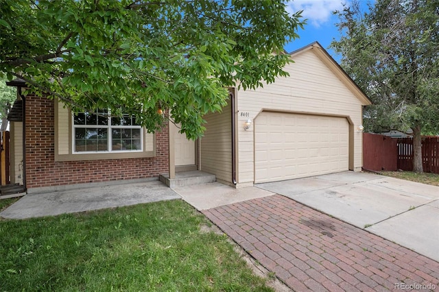 8401 Sandreed Cir, Parker, CO 80134 - view of front of house featuring concrete driveway, an attached garage, and brick siding