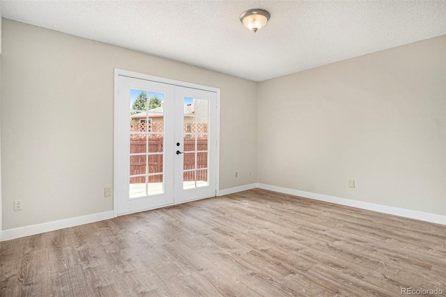 8401 Sandreed Cir, Parker, CO 80134 - empty room with french doors, wood finished floors, and a textured ceiling