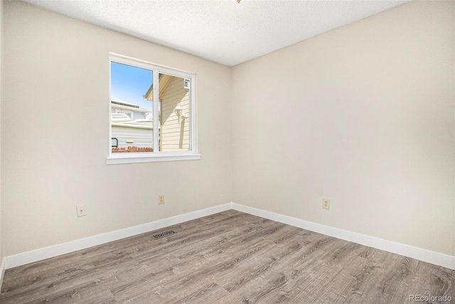 8401 Sandreed Cir, Parker, CO 80134 - unfurnished room with wood finished floors and a textured ceiling