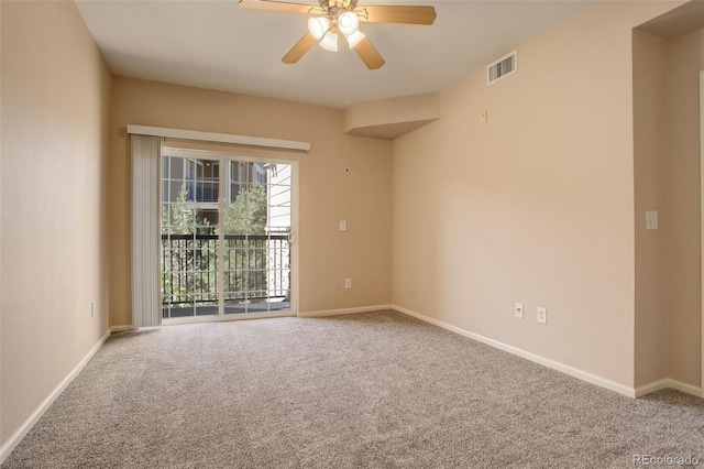 spare room with carpet and ceiling fan