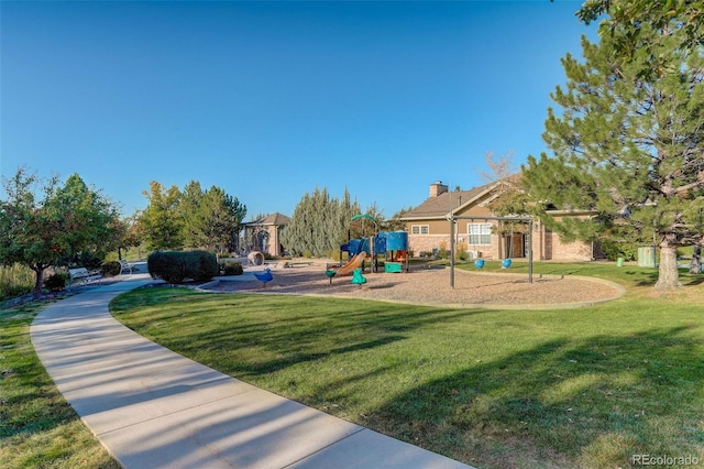 view of playground featuring a lawn