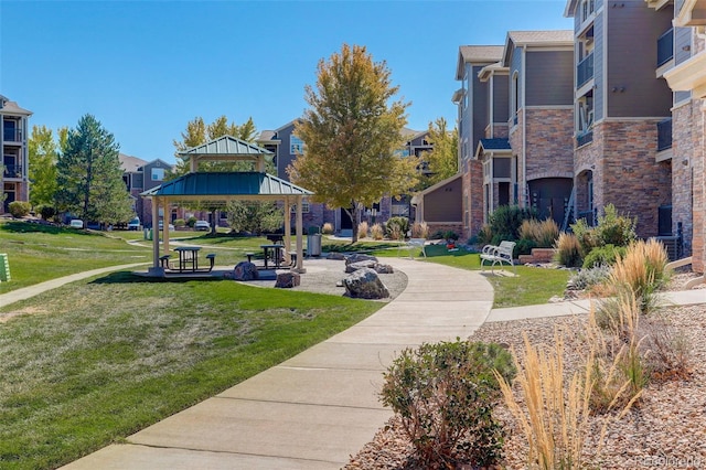 view of community with a lawn and a gazebo