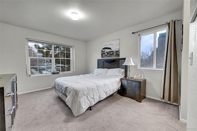 carpeted bedroom with a textured ceiling