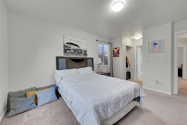 carpeted bedroom with a textured ceiling