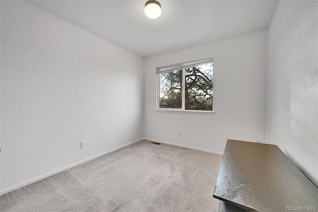 unfurnished room with carpet floors