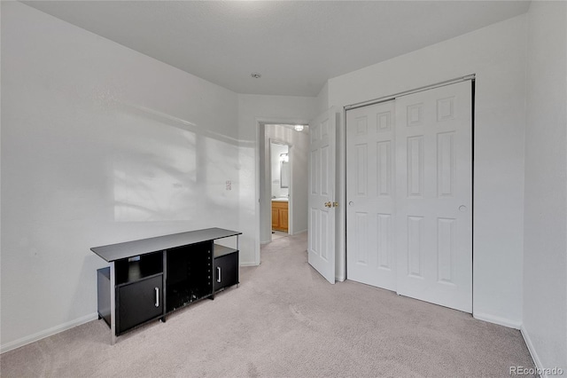 carpeted bedroom with a closet