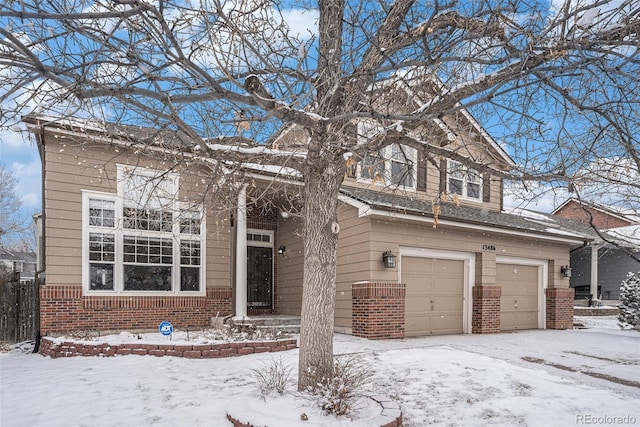 view of front facade featuring a garage and brick siding