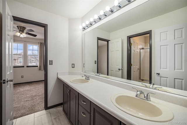 bathroom featuring ceiling fan and vanity