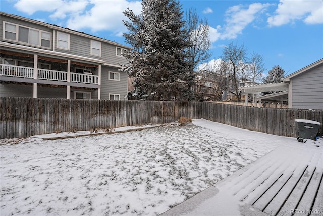 view of yard layered in snow