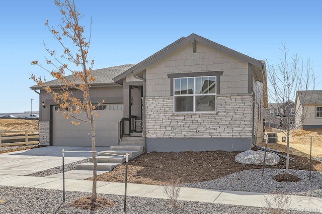 single story home featuring concrete driveway, an attached garage, central AC unit, and stone siding