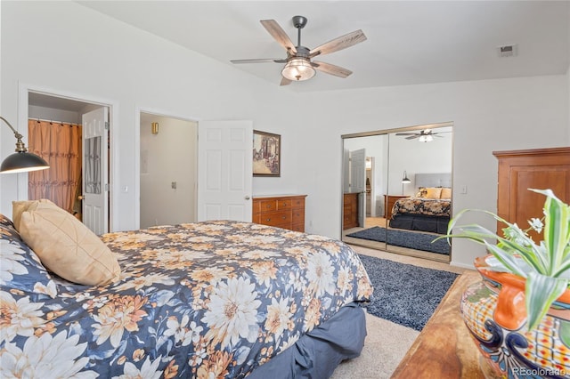 bedroom featuring a closet, a ceiling fan, and lofted ceiling