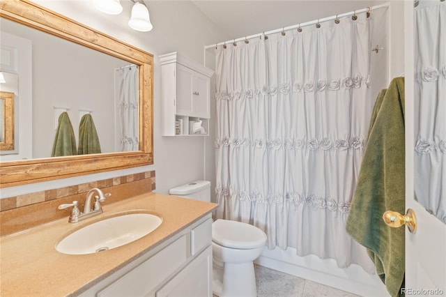 bathroom with toilet, tile patterned floors, vanity, and shower / bath combination with curtain