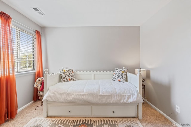 carpeted bedroom with baseboards