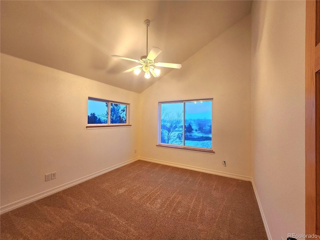 carpeted empty room featuring vaulted ceiling and ceiling fan