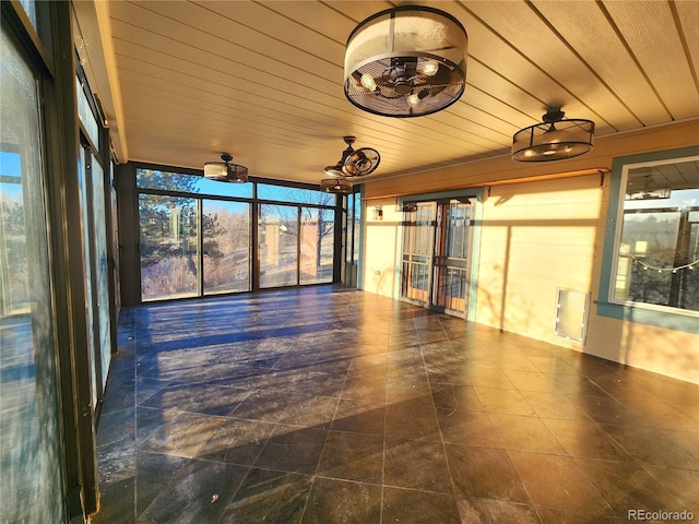 unfurnished sunroom with wood ceiling