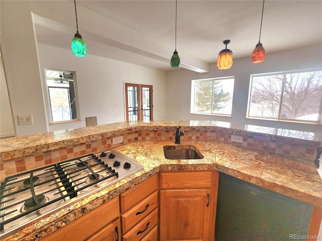 kitchen with a wealth of natural light, stainless steel gas stovetop, black dishwasher, sink, and french doors