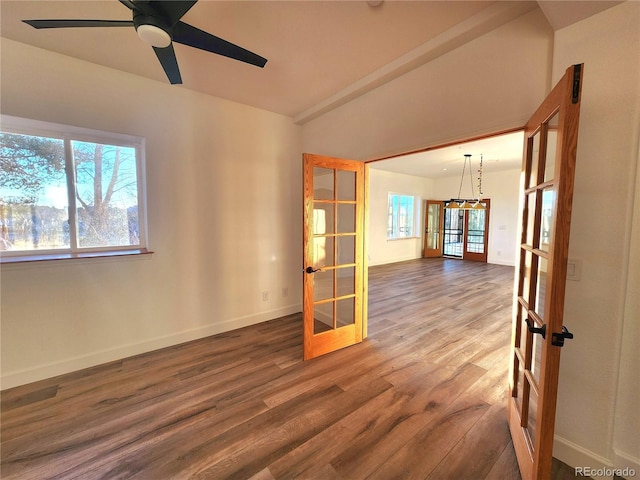 spare room with wood-type flooring, a wealth of natural light, and french doors