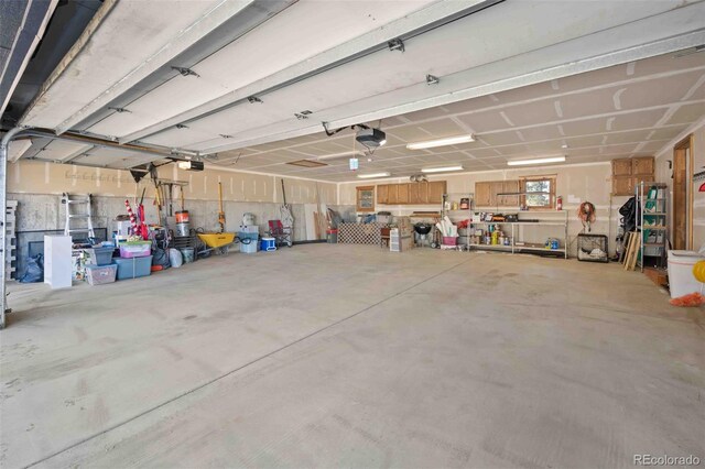 538 Sawmill Creek Rd, Evergreen, CO 80439 - garage featuring a garage door opener