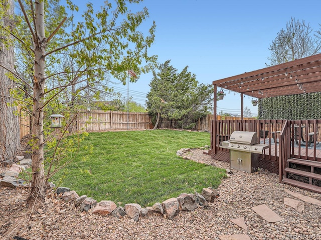 view of yard featuring a pergola and a deck