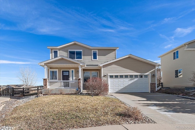 view of front of house featuring covered porch and a garage