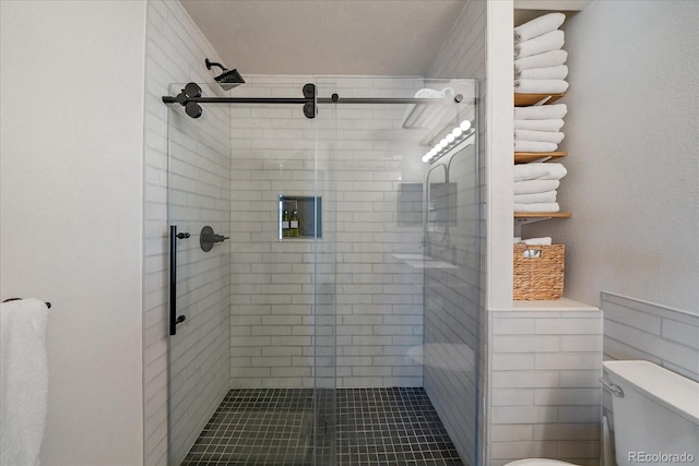 bathroom with toilet and walk in shower