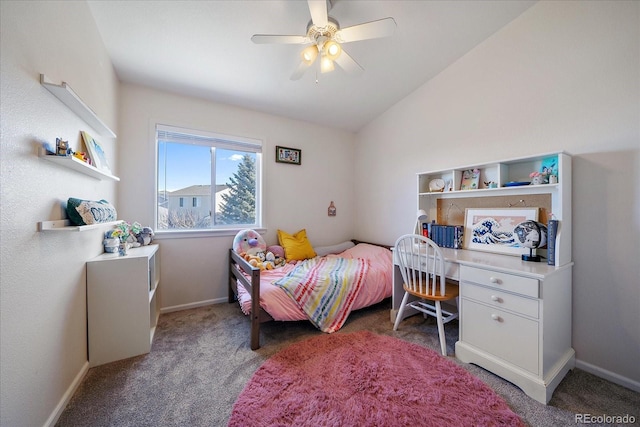 bedroom with ceiling fan, lofted ceiling, and dark colored carpet