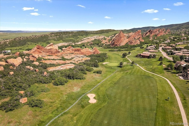 birds eye view of property with a mountain view