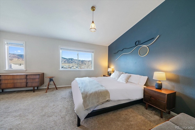 bedroom featuring carpet flooring and vaulted ceiling