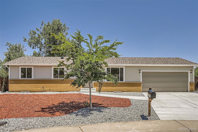 16273 E Brown Pl, Aurora, CO 80013 - ranch-style home with brick siding, a garage, driveway, and a shingled roof